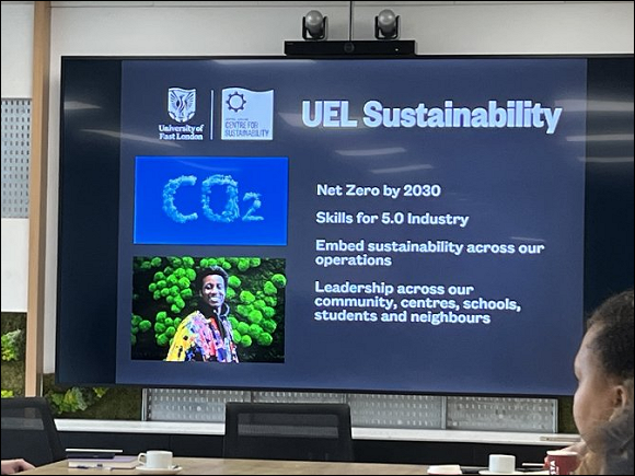 A slide on a projector screen saying UEL Sustainability and highlighting Net Zero by 2030